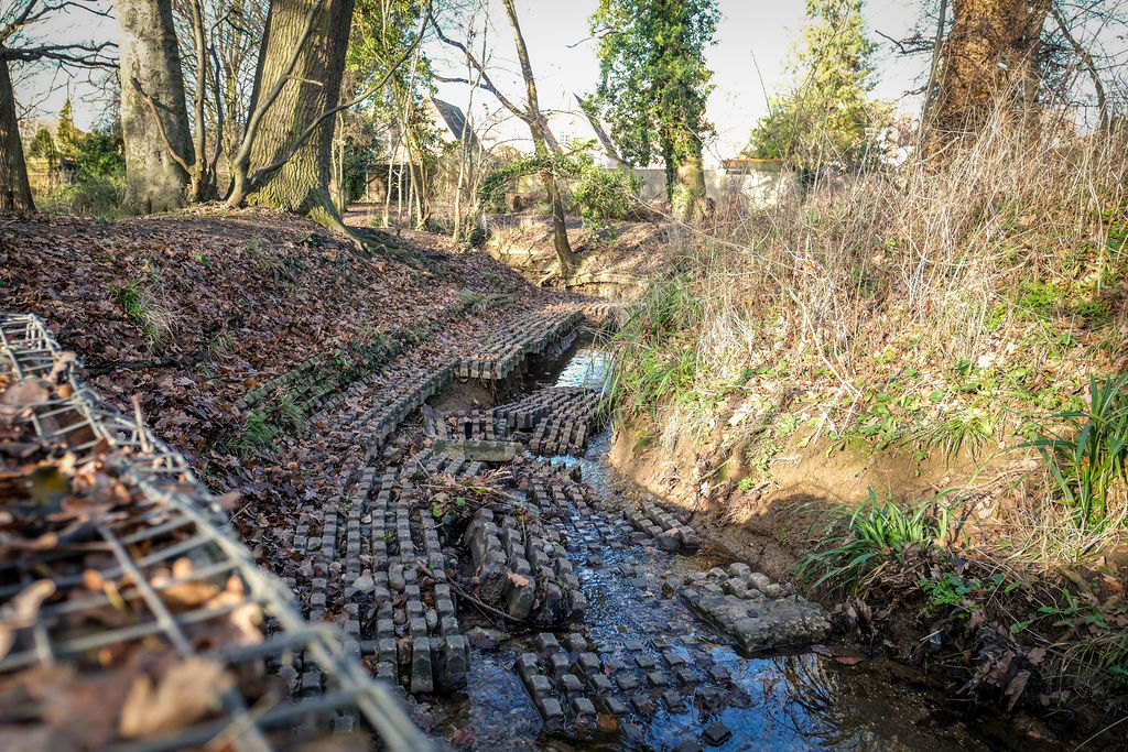 The river flowing over concrete blocks